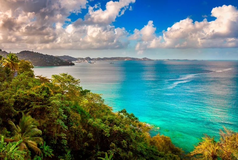 BVI shoreline with anchored sailboats and small village above