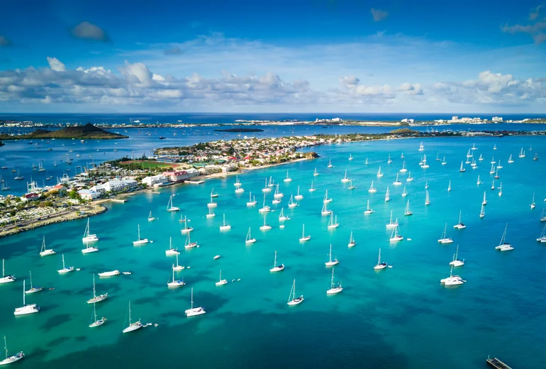 Catamaran sailing in BVI trade winds with downwind run