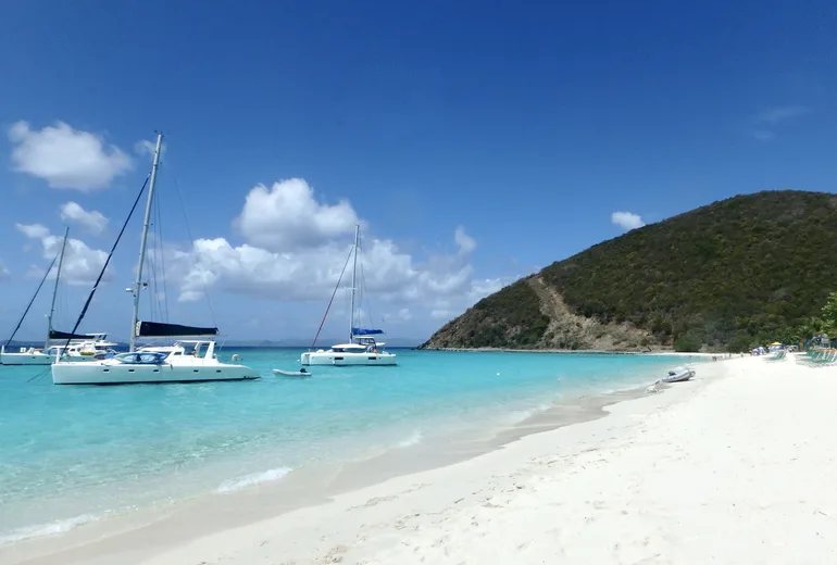 Charter catamarans anchored off White Bay beach on Jost Van Dyke, British Virgin Islands
